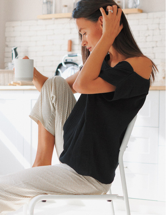 Black muslin T-shirt with an asymmetrical neckline
