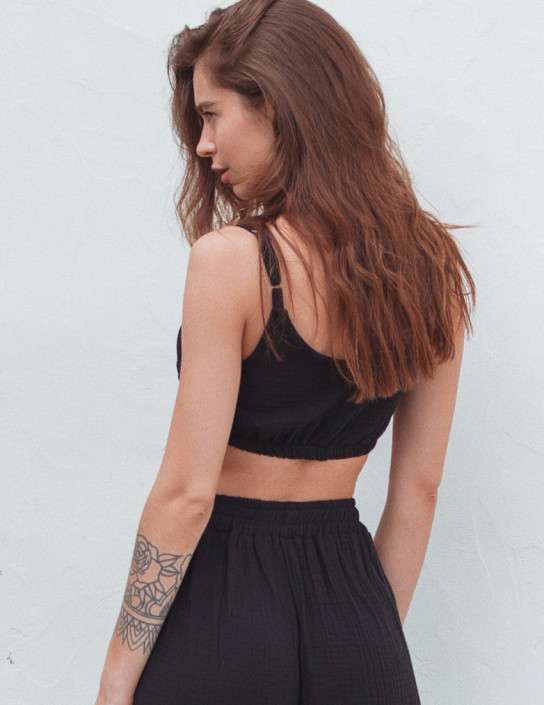 Black short top with thin straps made of muslin